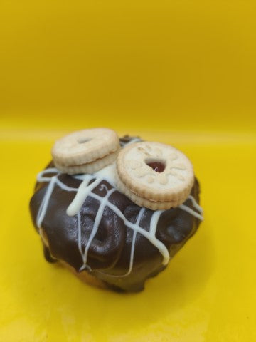 Our original choc chip base, stuffed with jam dodgers, a blast of Raspberry jam topped with more biscuit and chocolate ganache. You definitely cant dodge this one! 