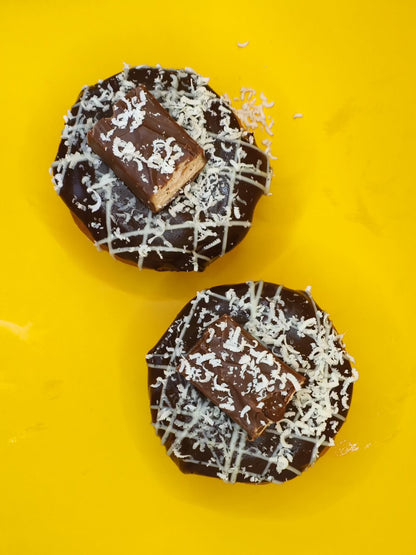 Our our original choc chip dough stuffed cookie with milky way and white chocolate, choc stars and topped with chocolate ganache, milky way with white chocolate shavings and stripes !
